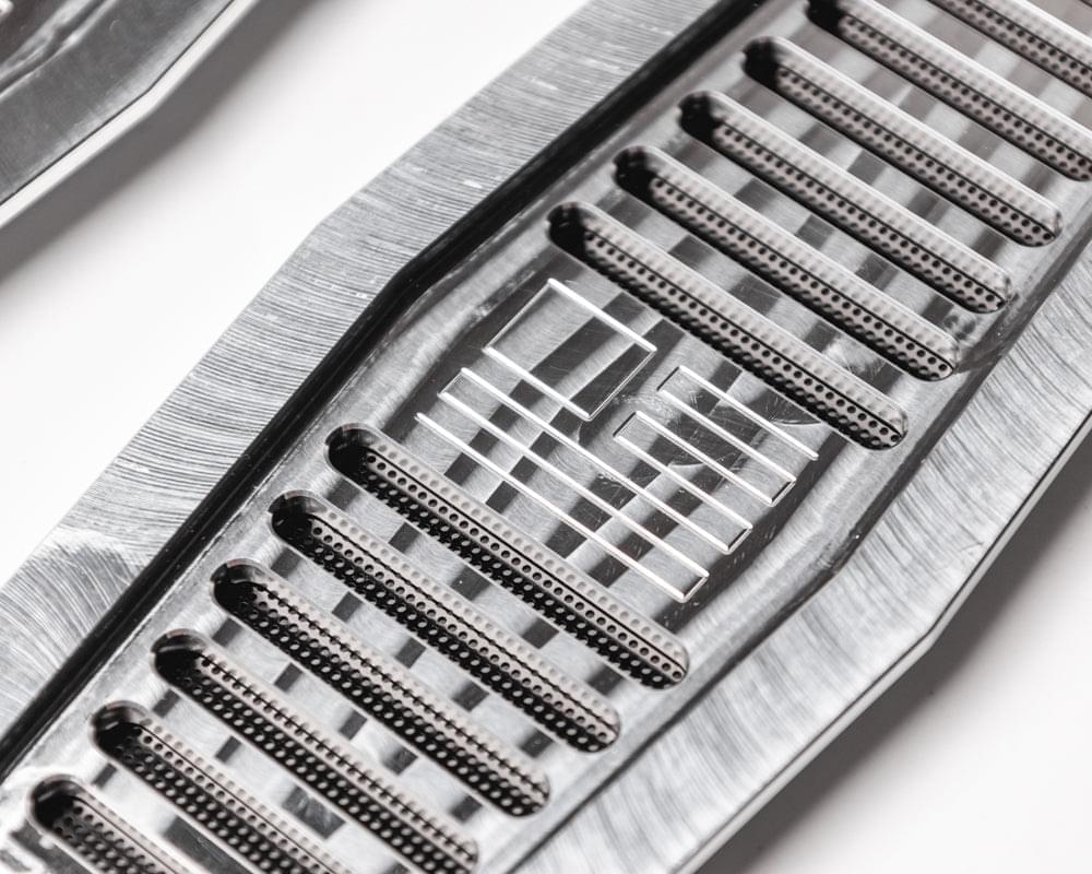 Engraved aluminum vent