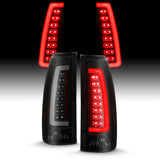 Par de luces traseras LED ANZO 1988-1999 C/K1500 con carcasa negra y lente ahumada 