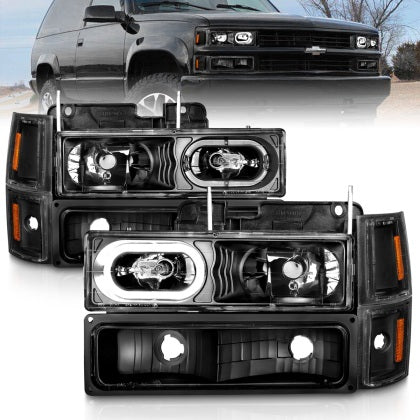 Faros delanteros de cristal ANZO 88-98 Chevrolet C1500 con carcasa negra y luces de posición laterales